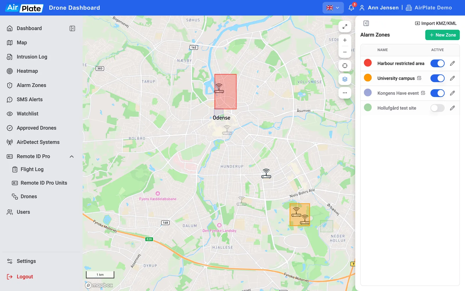 The Alarm Zones page: four zones in the list with their colours and Active switches, and the zones on the map