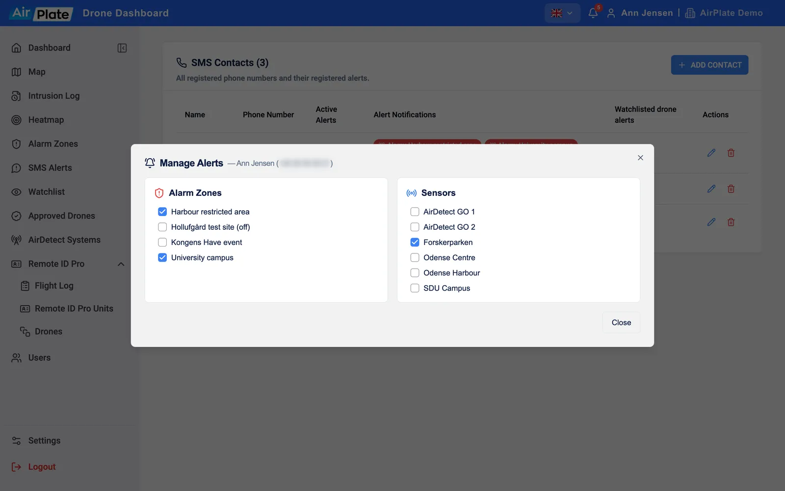 The Manage Alerts dialog for one contact: alarm zones and sensors with checkboxes, some ticked, and a switched-off zone marked (off)