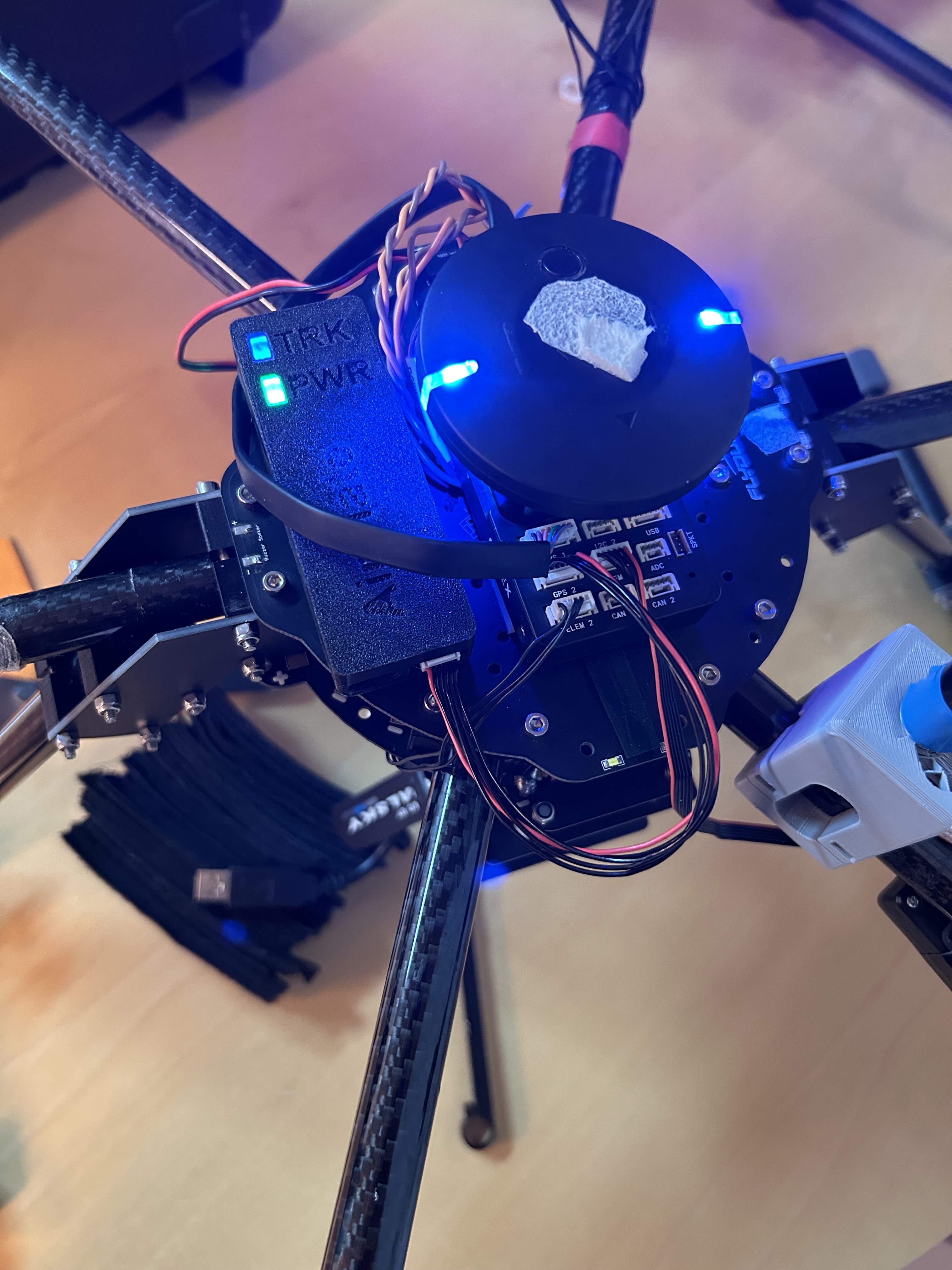 A Remote ID Pro powered from a drone through a cable in its MAVLink port