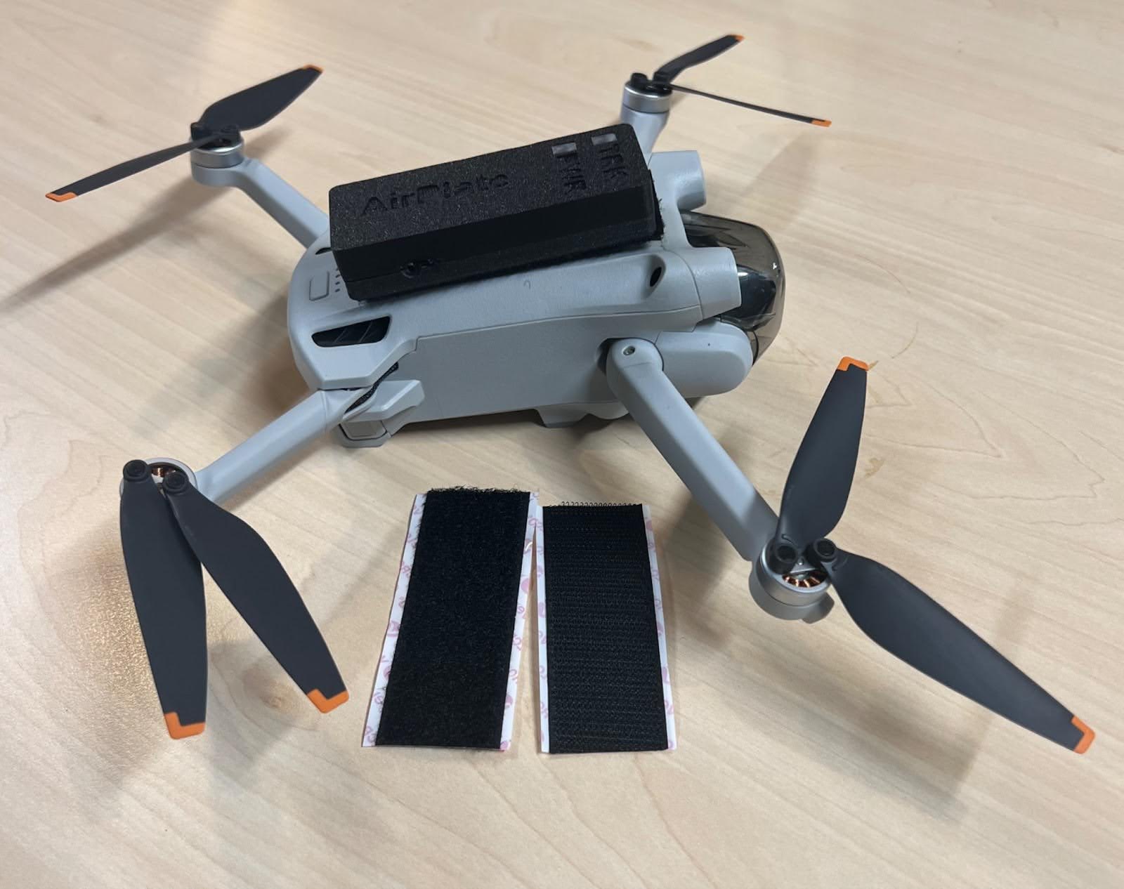 A Remote ID Pro attached to a drone with velcro